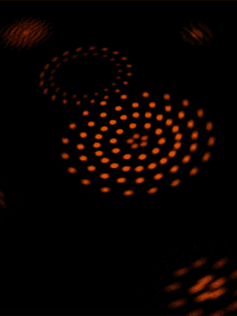 a black background with orange dots in a circular pattern