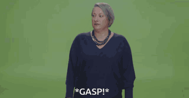 a woman in a blue sweater screams gasp