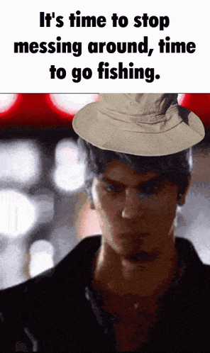 a man wearing a hat with the words " it 's time to stop messing around time to go fishing "