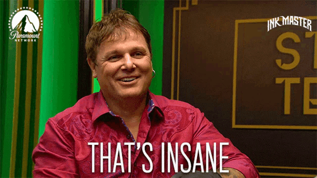 a man in a red shirt with the words that 's insane on the bottom