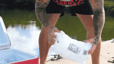 Pouring Ice Into The Cooler Jon Langston GIF - Pouring Ice Into The Cooler Jon Langston Day In The 90'S Song GIFs