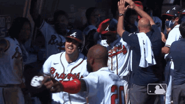 a group of braves baseball players are celebrating