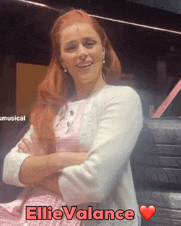 a woman with red hair and the name ellie valance on the bottom right