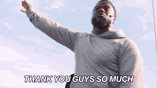 a man says " thank you guys so much " in a gray shirt