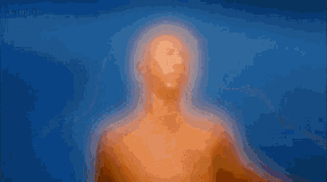 a blurred image of a man with his arms outstretched with the words reality tv visible in the corner