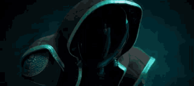 a robot with a sad face on it is surrounded by lightning bolts in a dark room .