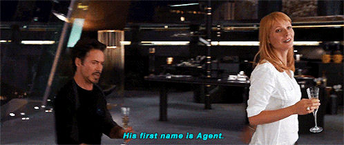 a man and a woman standing next to each other with the woman saying his first name is agent
