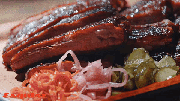 a close up of a plate of food with esquire written on the bottom right