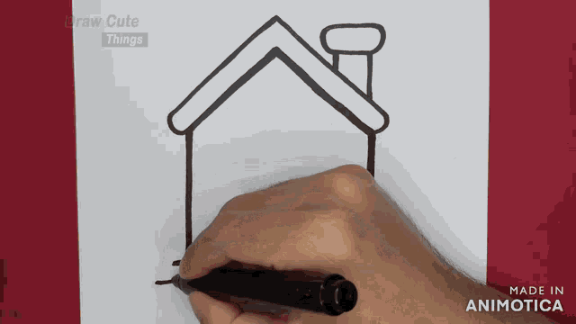 a person is drawing a house with a chimney on a piece of paper made by animatica