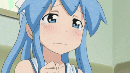a girl with blue hair is crying with a tear running down her face