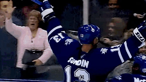 a hockey player wearing a blue jersey with the number 1 on it