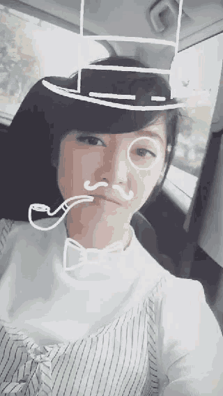 a woman wearing a hat and a bow tie has a pipe drawn on her face