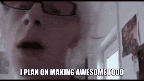 a woman is wearing glasses and smoking a cigarette and says `` i plan on making awesome food '' .