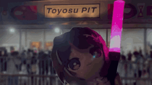 toyosu pit is written on a sign that is above a doll