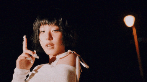 a close up of a woman with short black hair
