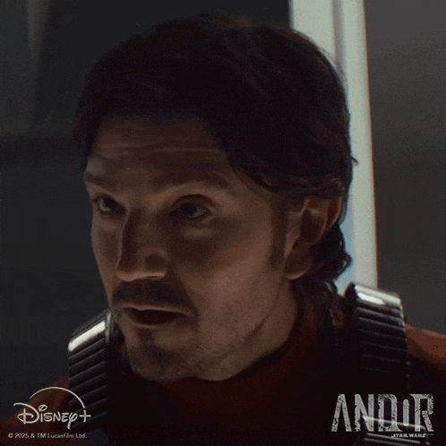 a close up of a man 's face with the word andor on the bottom right