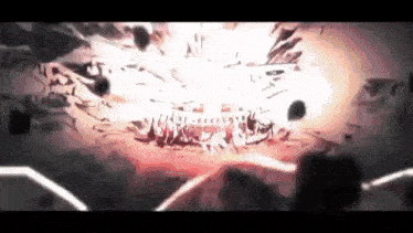 a person is standing in front of a large explosion .