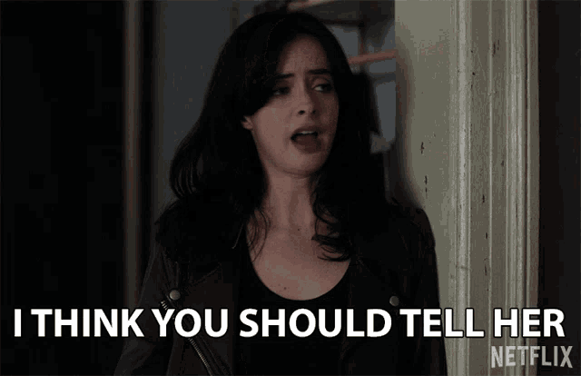 a woman in a leather jacket says i think you should tell her