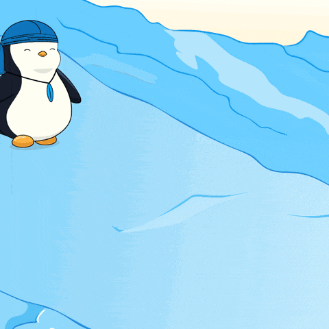 a penguin wearing a blue bandana is sitting on a blue surface