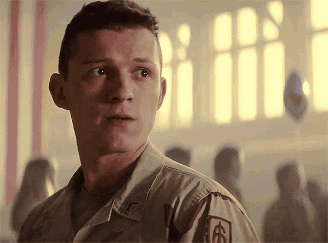 a man in a military uniform has a patch on his chest that says ' u.s. army ' on it