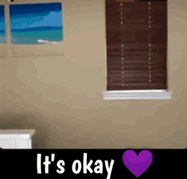 a room with a purple heart and the words it 's okay