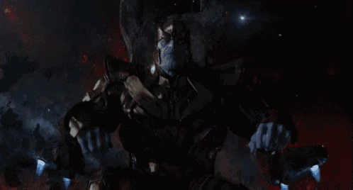 thanos from avengers infinity war is sitting on a throne in the dark