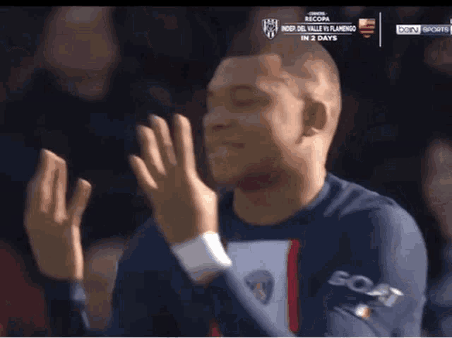 a soccer player wearing a jersey that says goat on it