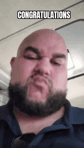 a bald man with a beard is making a funny face and says `` congratulations '' .