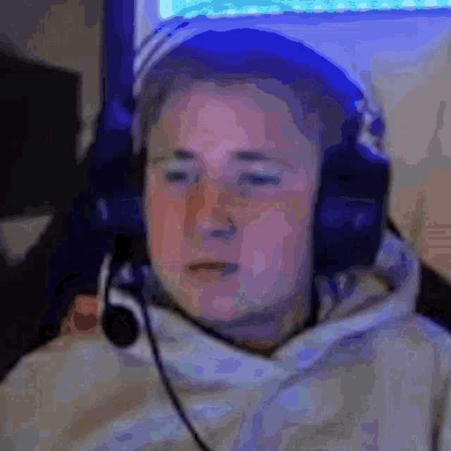 a blurry picture of a man wearing headphones and a hat