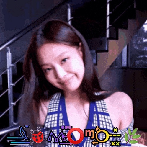 a woman is smiling in front of a staircase and a sign that says momo xxx
