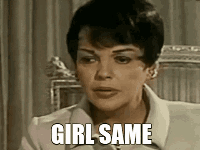 a woman is sitting in a chair with the words `` girl same '' on her face .