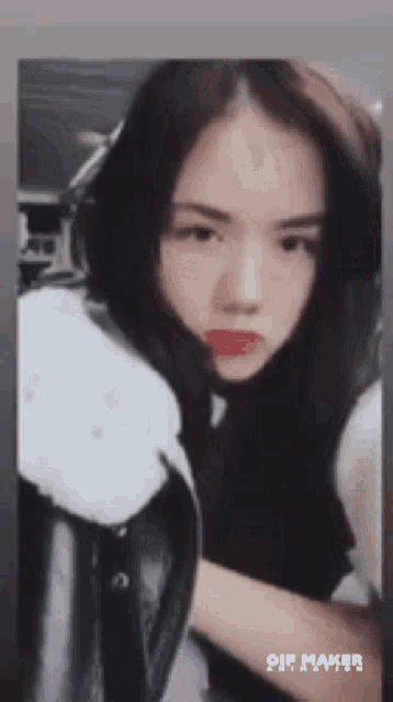 a close up of a woman 's face with a gif maker watermark on the bottom