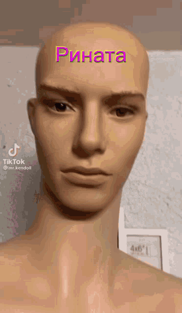 a bald mannequin has the name rinata written on it