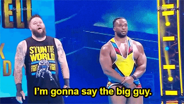 two wrestlers are standing on a stage and one of them is saying `` i 'm gonna say the big guy ''