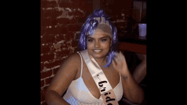 a woman is wearing a sash that says bride