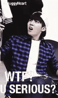 a young man wearing a plaid shirt and a hat says wtf ? u serious ?