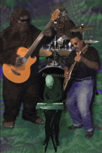 a group of people playing instruments in front of a ludwig drum set