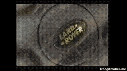 a close up of a land rover logo on a glass