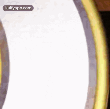 a close up of two circles with the words kulfyapp.com in the corner