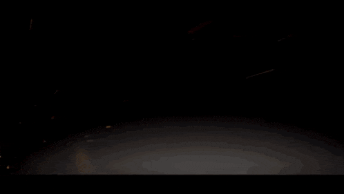 a glowing circle in the dark with the letter s in the middle