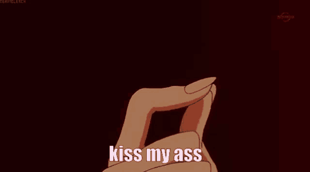 a hand is holding a heart with the words kiss my ass written on it