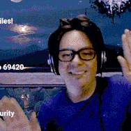 a man wearing headphones and glasses is waving his hand in front of a sign that says 69420
