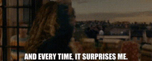 a woman says " and every time it surprises me " in front of a crowd of people