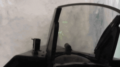 a cockpit of a fighter jet with a screen that says ' altitude '