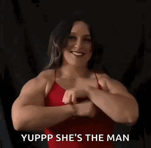 a woman in a red dress is making a gesture with her hands and says yupp she 's the man