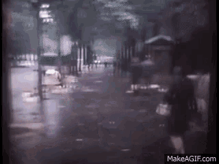 a blurred image of a person walking down a street