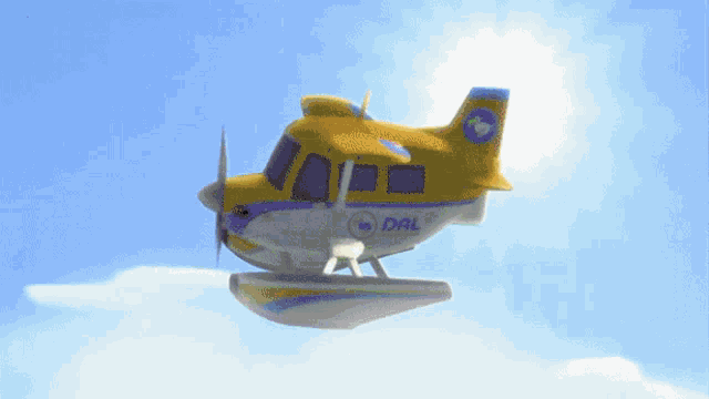 a yellow and blue airplane with dal written on the tail