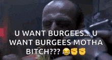 a man is eating a hamburger and smoking a cigarette while holding a gun in his hand .