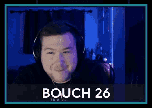 a man wearing a headset is laughing with the words bauch 26 below him