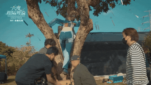 a group of people standing around a tree with the words love talk written on the top